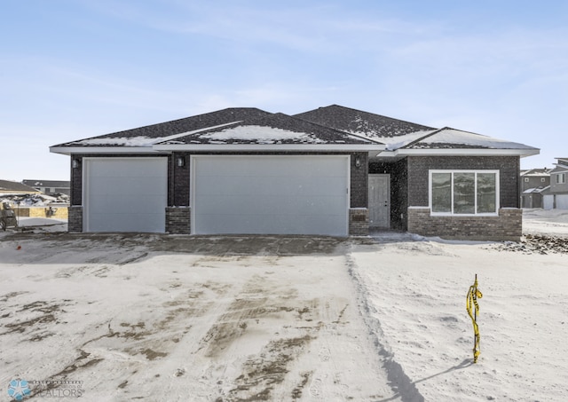 prairie-style house featuring a garage