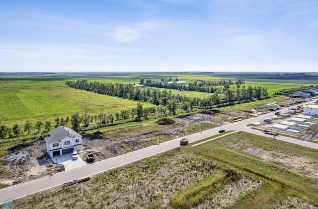 birds eye view of property with a rural view