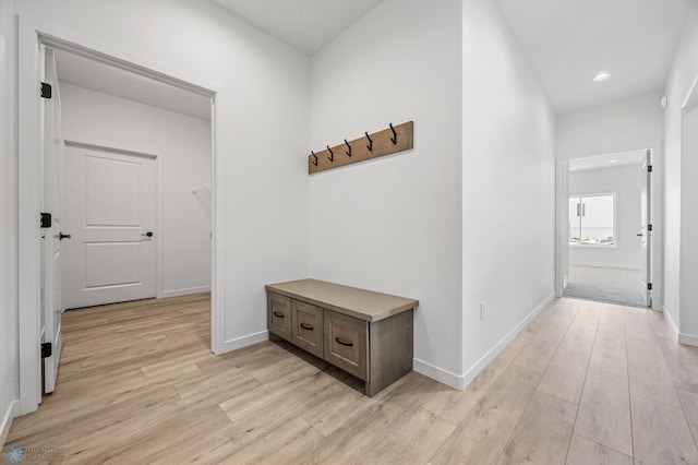 hallway with light hardwood / wood-style flooring