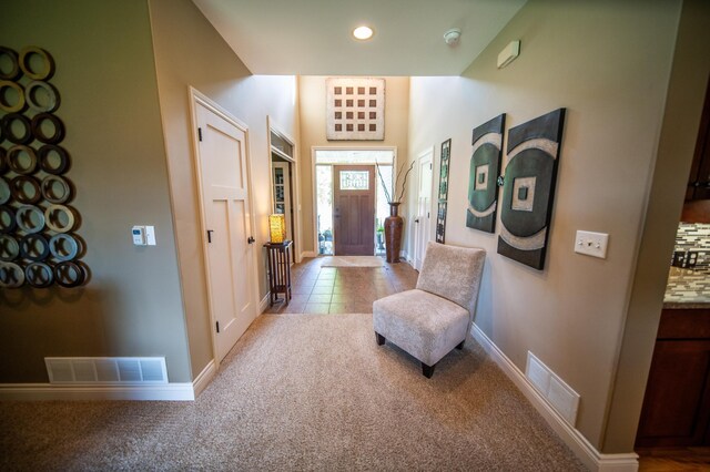 2441 Rosewood Ln SW, Rochester, MN 55902 - carpeted foyer entrance featuring baseboards, recessed lighting, and tile patterned flooring