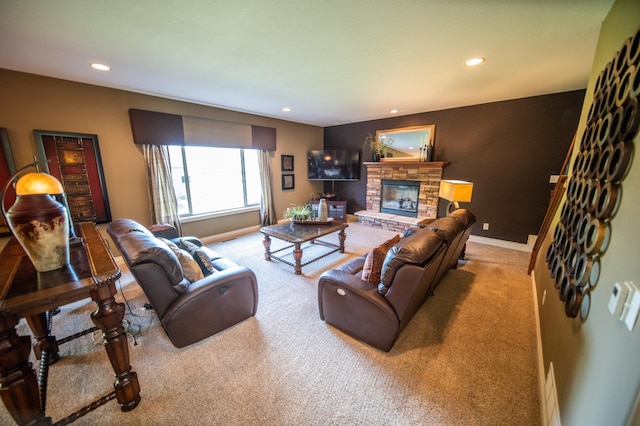 2441 Rosewood Ln SW, Rochester, MN 55902 - carpeted living room with recessed lighting, a stone fireplace, and baseboards