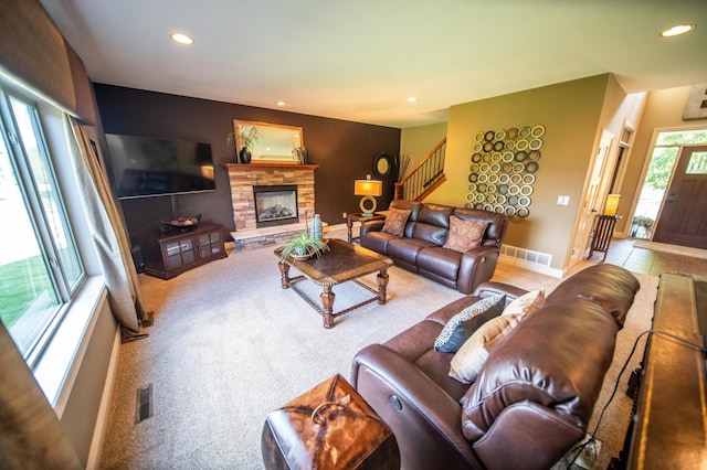2441 Rosewood Ln SW, Rochester, MN 55902 - carpeted living room with stairs, recessed lighting, a fireplace, and baseboards