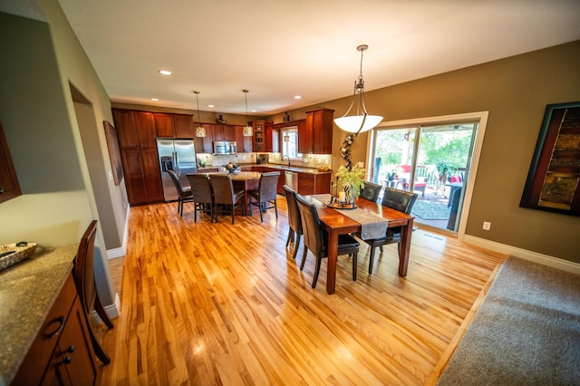 2441 Rosewood Ln SW, Rochester, MN 55902 - dining space with light wood-type flooring, recessed lighting, and baseboards