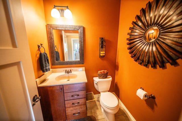 2441 Rosewood Ln SW, Rochester, MN 55902 - bathroom with toilet, tile patterned flooring, vanity, and baseboards