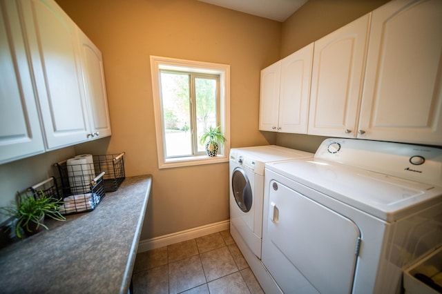 2441 Rosewood Ln SW, Rochester, MN 55902 - laundry room featuring separate washer and dryer, cabinet space, baseboards, and light tile patterned floors