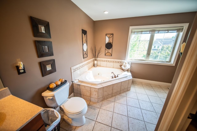2441 Rosewood Ln SW, Rochester, MN 55902 - bathroom with toilet, a whirlpool tub, tile patterned flooring, baseboards, and vanity
