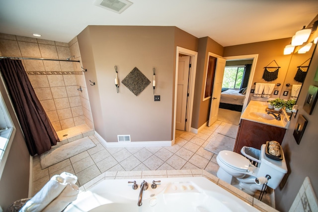 2441 Rosewood Ln SW, Rochester, MN 55902 - ensuite bathroom featuring a garden tub, vanity, toilet, tiled shower, and tile patterned flooring