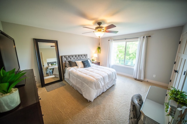 2441 Rosewood Ln SW, Rochester, MN 55902 - bedroom featuring light colored carpet, baseboards, and ceiling fan