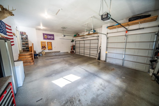2441 Rosewood Ln SW, Rochester, MN 55902 - garage featuring a garage door opener