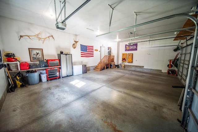 2441 Rosewood Ln SW, Rochester, MN 55902 - garage featuring a garage door opener