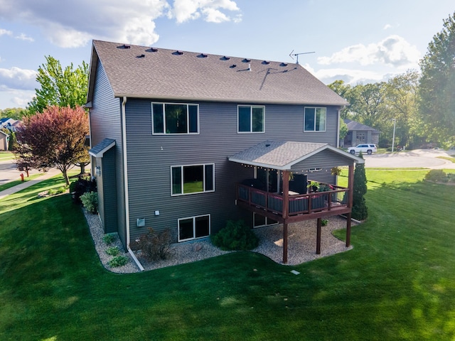 2441 Rosewood Ln SW, Rochester, MN 55902 - back of property with a yard, a shingled roof, and a wooden deck