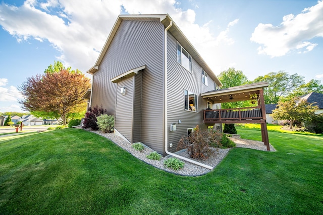 2441 Rosewood Ln SW, Rochester, MN 55902 - view of side of property featuring a yard and a wooden deck