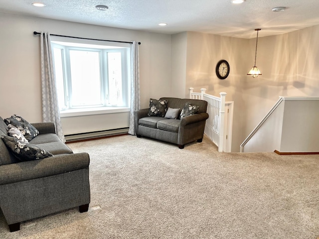 carpeted living room featuring a textured ceiling and baseboard heating