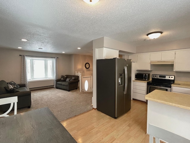 kitchen featuring white cabinetry, light hardwood / wood-style flooring, baseboard heating, and appliances with stainless steel finishes