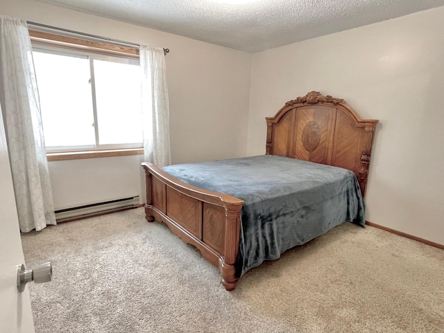 bedroom with a baseboard radiator, light colored carpet, and a textured ceiling