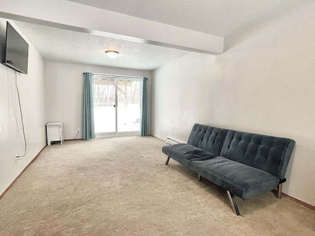 living area with a baseboard radiator, carpet floors, and a textured ceiling