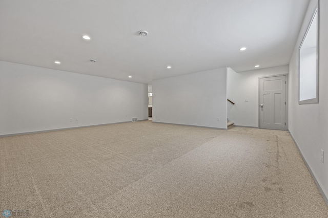 unfurnished room with light colored carpet