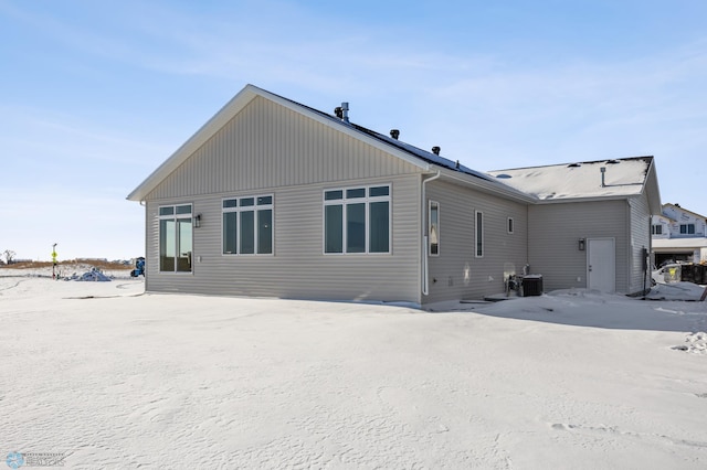 rear view of house with central air condition unit