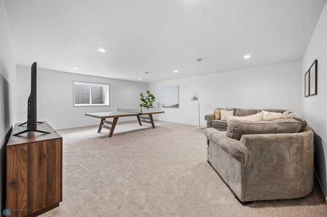 living room featuring light carpet and recessed lighting
