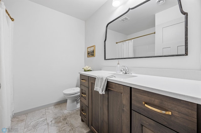 bathroom featuring vanity, toilet, marble finish floor, baseboards, and visible vents