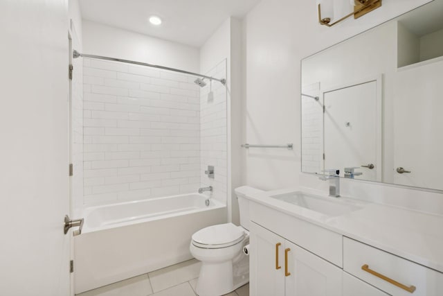 full bathroom with tiled shower / bath combo, vanity, tile patterned floors, and toilet