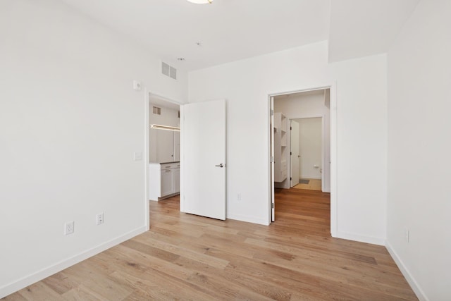 unfurnished bedroom with light hardwood / wood-style floors