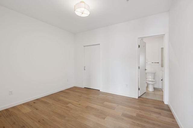 spare room with light hardwood / wood-style flooring