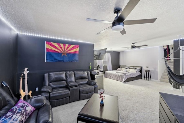 carpeted bedroom with a ceiling fan and a textured ceiling