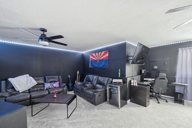 carpeted living room with ceiling fan and a textured ceiling