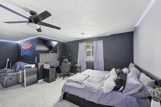 bedroom featuring a textured ceiling, carpet, and a ceiling fan