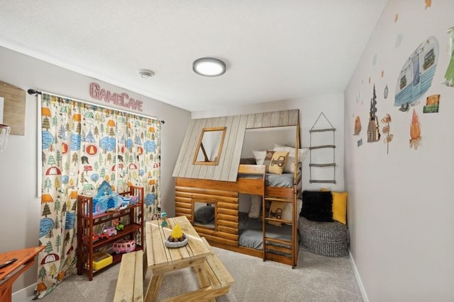 carpeted bedroom with baseboards