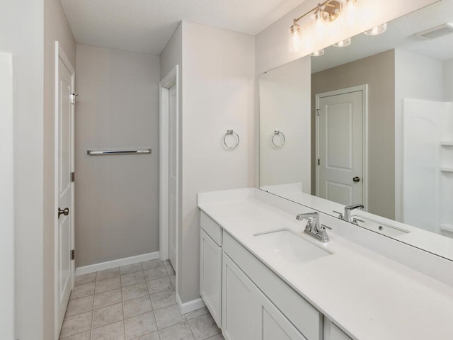 bathroom featuring tile patterned floors and vanity