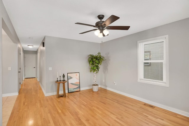 spare room with ceiling fan and light hardwood / wood-style flooring