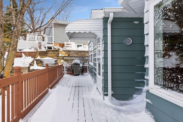 view of snow covered deck