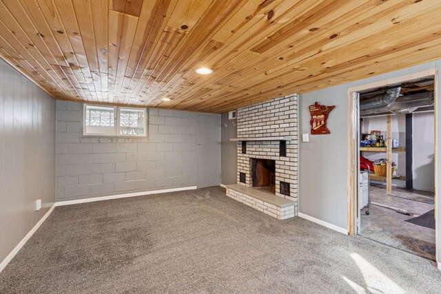 below grade area with carpet, wood ceiling, a fireplace, and baseboards