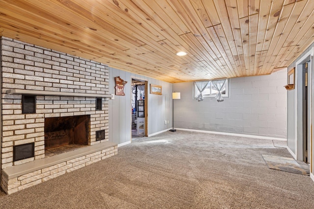 below grade area with wooden ceiling, a fireplace, and carpet flooring