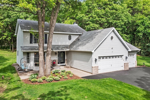 17130 Uplander Cir NW, Andover, MN 55304 - view of front of home with a garage, asphalt driveway, a front yard, and a shingled roof