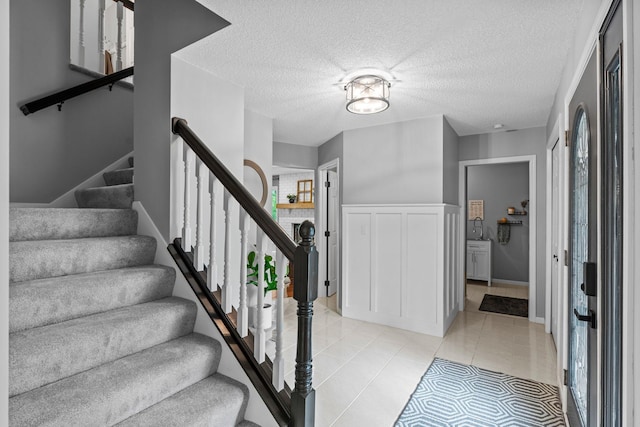 17130 Uplander Cir NW, Andover, MN 55304 - staircase with tile patterned floors and a textured ceiling