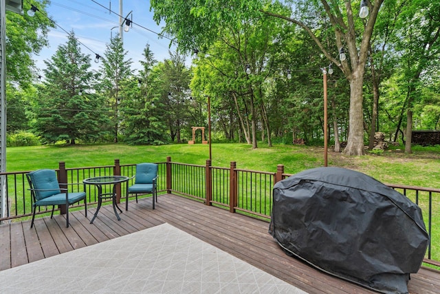 17130 Uplander Cir NW, Andover, MN 55304 - wooden deck featuring a lawn, area for grilling, and view of wooded area