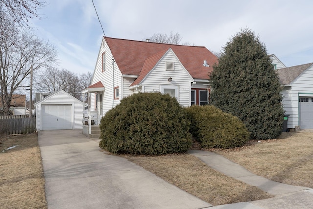 view of side of property featuring a garage and an outdoor structure