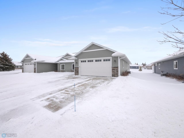 view of front of home with cooling unit and a garage