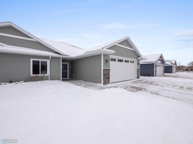 single story home featuring a garage