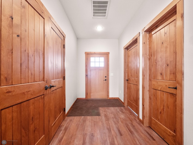 doorway to outside featuring wood-type flooring