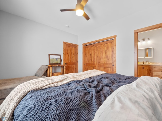 bedroom with connected bathroom, sink, a closet, and ceiling fan