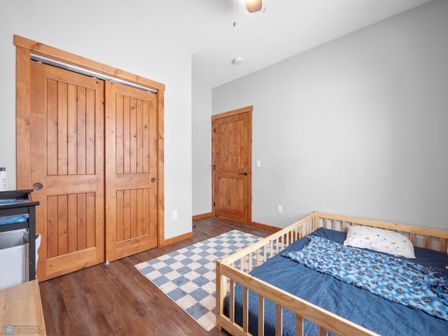 bedroom featuring ceiling fan and dark hardwood / wood-style floors