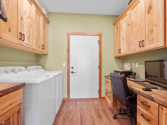 laundry room featuring cabinets, separate washer and dryer, and light wood-type flooring