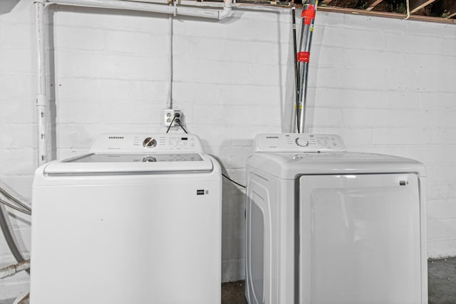 clothes washing area with independent washer and dryer