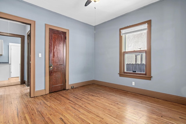 spare room with ceiling fan and light hardwood / wood-style flooring