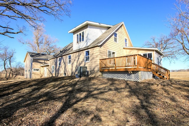 back of property featuring a deck