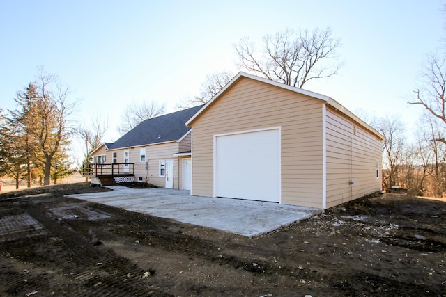 detached garage featuring driveway